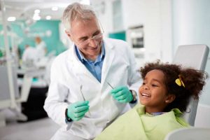 male-dentist-with-patient