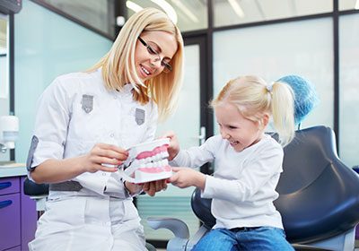 female-dentist-and-young-girl