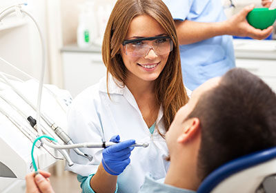 female-dentist-performing-exam